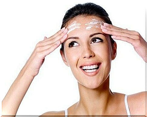 Woman applying a wrinkle cream