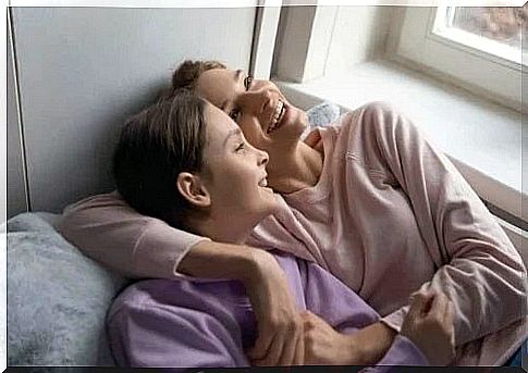 Mother and daughter laughing together