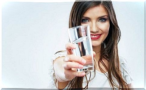 Woman drinking a juice for natural bowel cleansing