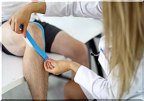 Doctor treating a sprained knee