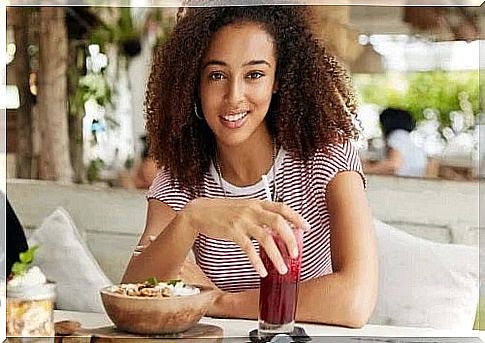 Girl eating a smoothie bowl for breakfast